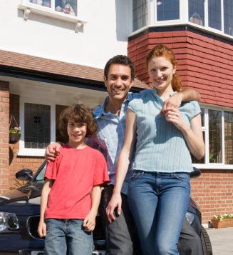 Family Portrait in front of Suburban Home
