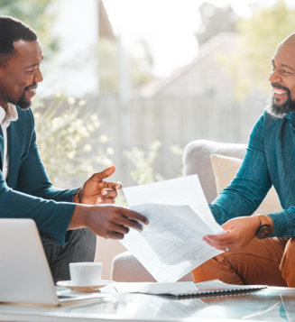 two men smiling at each other